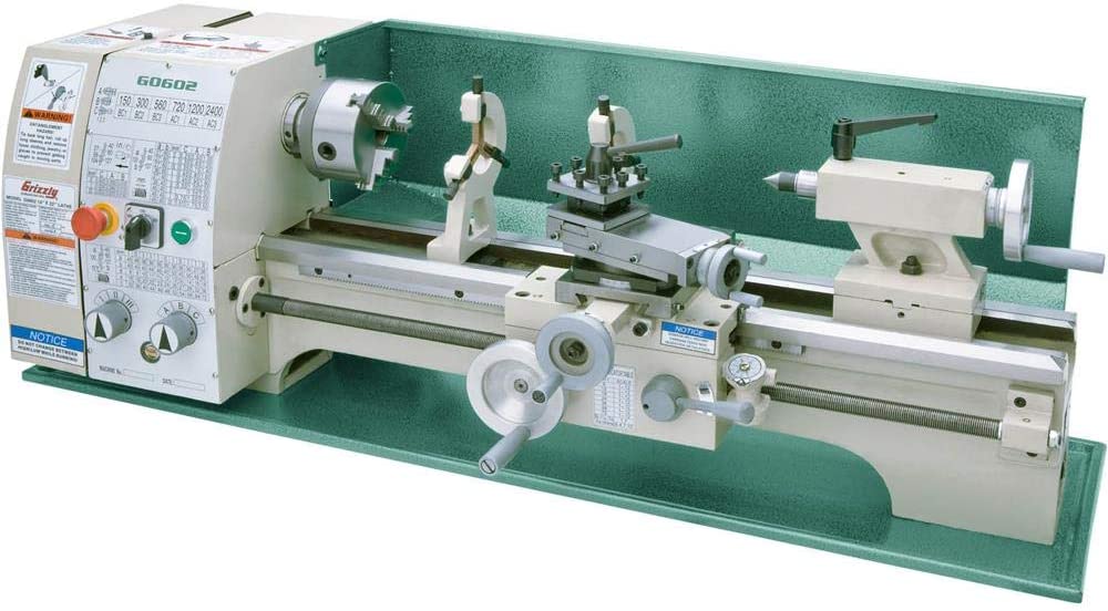 Grizzly G0766 metal lathe with green body and white bed in a white background