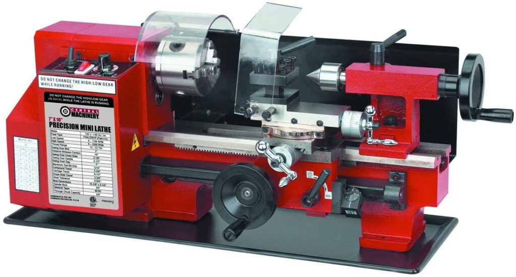 "Red and black colored Central Machinery 7 x 10 Precision Mini metal Lathe in a white background"