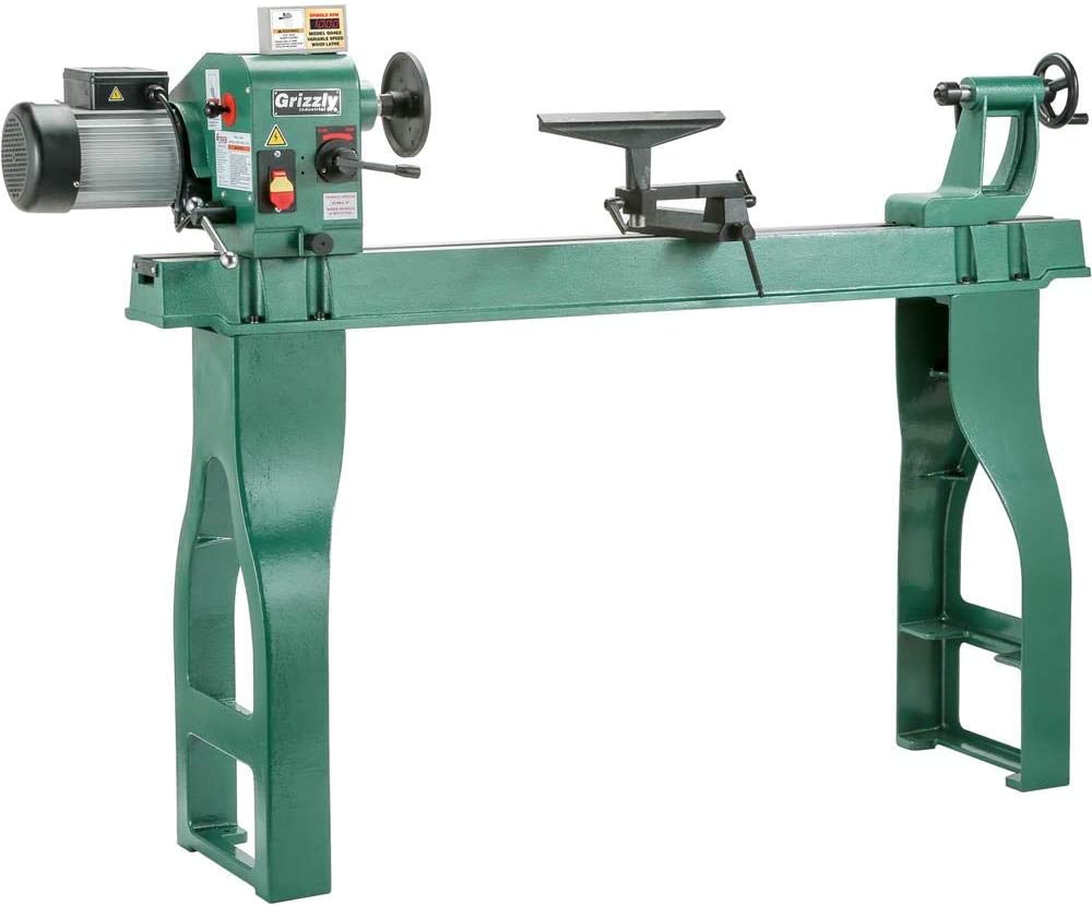 "Green colored Grizzly-Industrial-G0462 lathe in a white background"