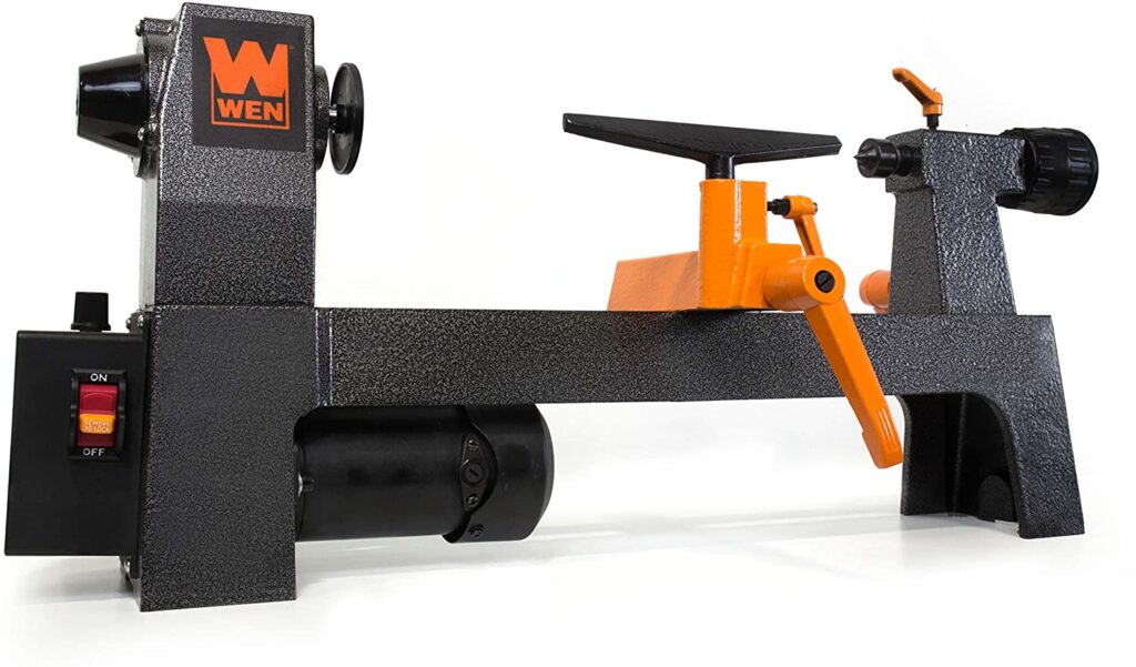 "Black body with orange tool rest, Wen-3421 mini wood lathe in a white background"