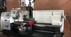 "Picture of a white colored lathe mill combo inside a workshop"