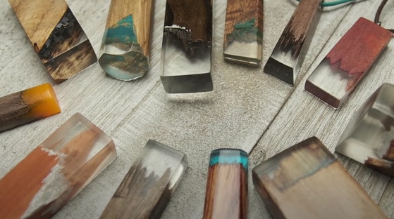"different colored resin pen blanks on a table"